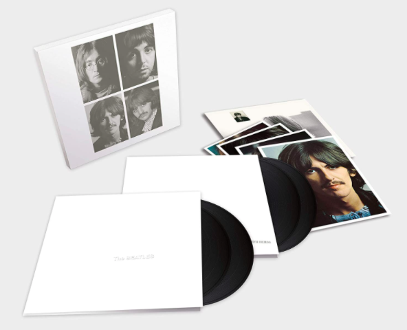 The White Album and its vinyl discs arranged on a blank surface
