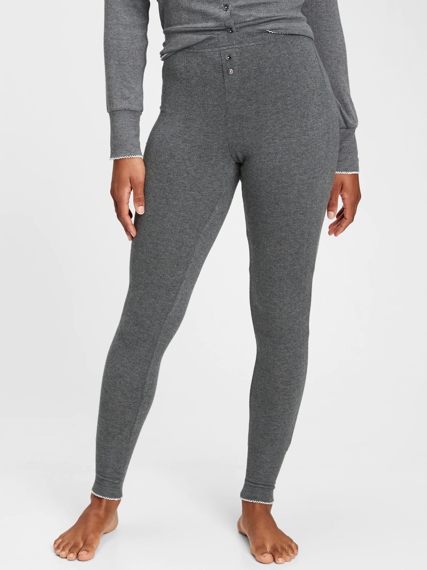 Model wearing grey leggings