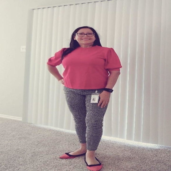 Reviewer wearing the blouse in pink