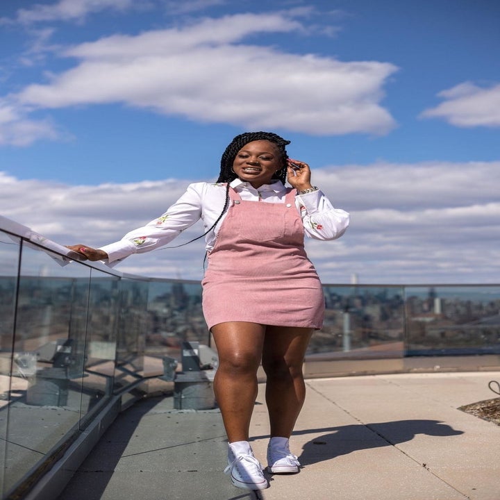 A different reviewer wearing the dress in pink