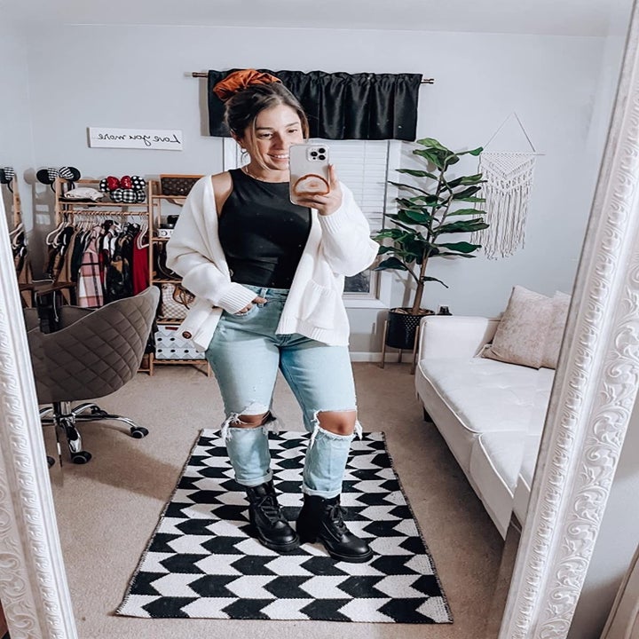 A different reviewer wearing the bodysuit in black