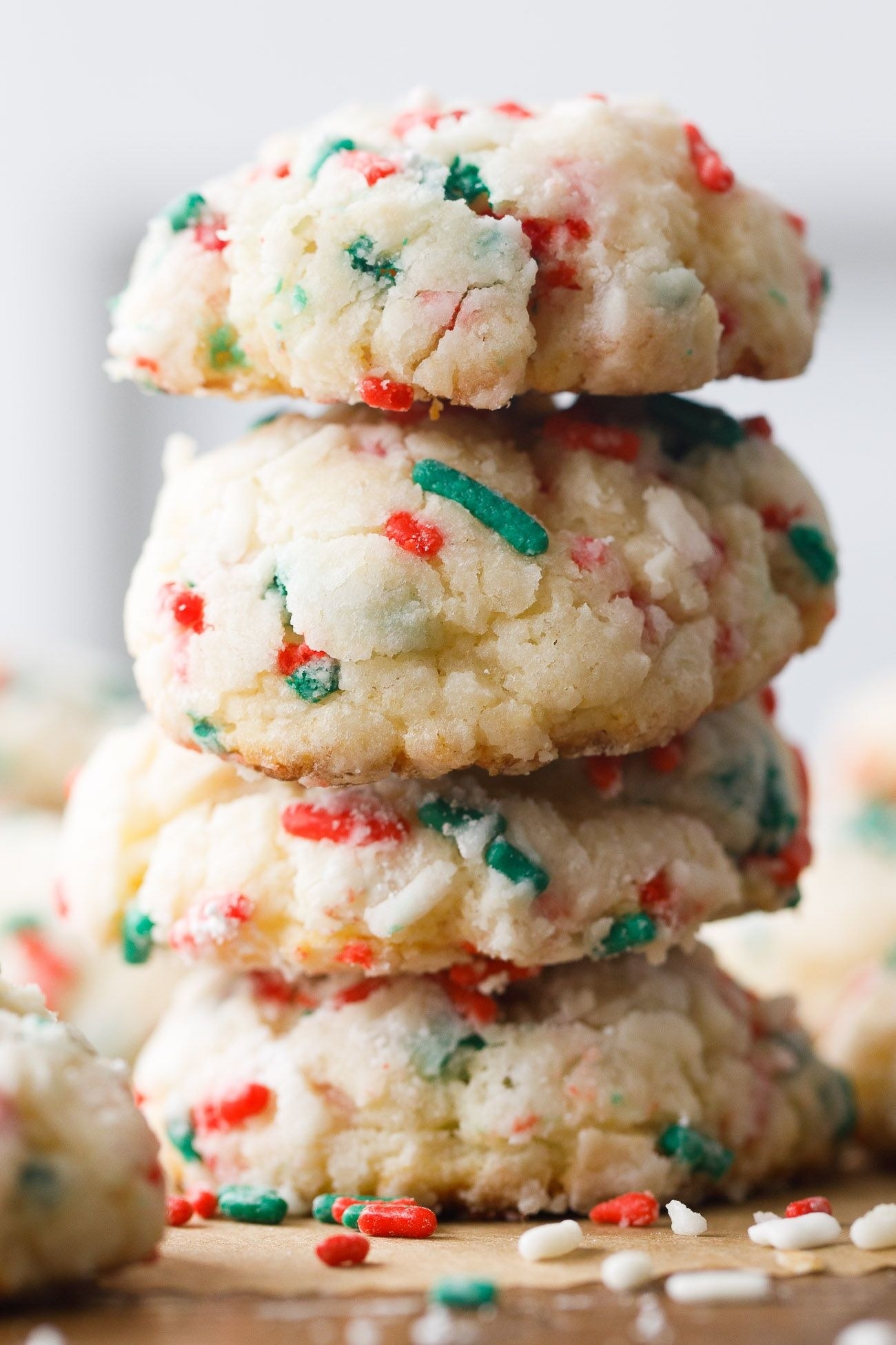 A stack of sugar cookies with Christmas-colored sprinkles.