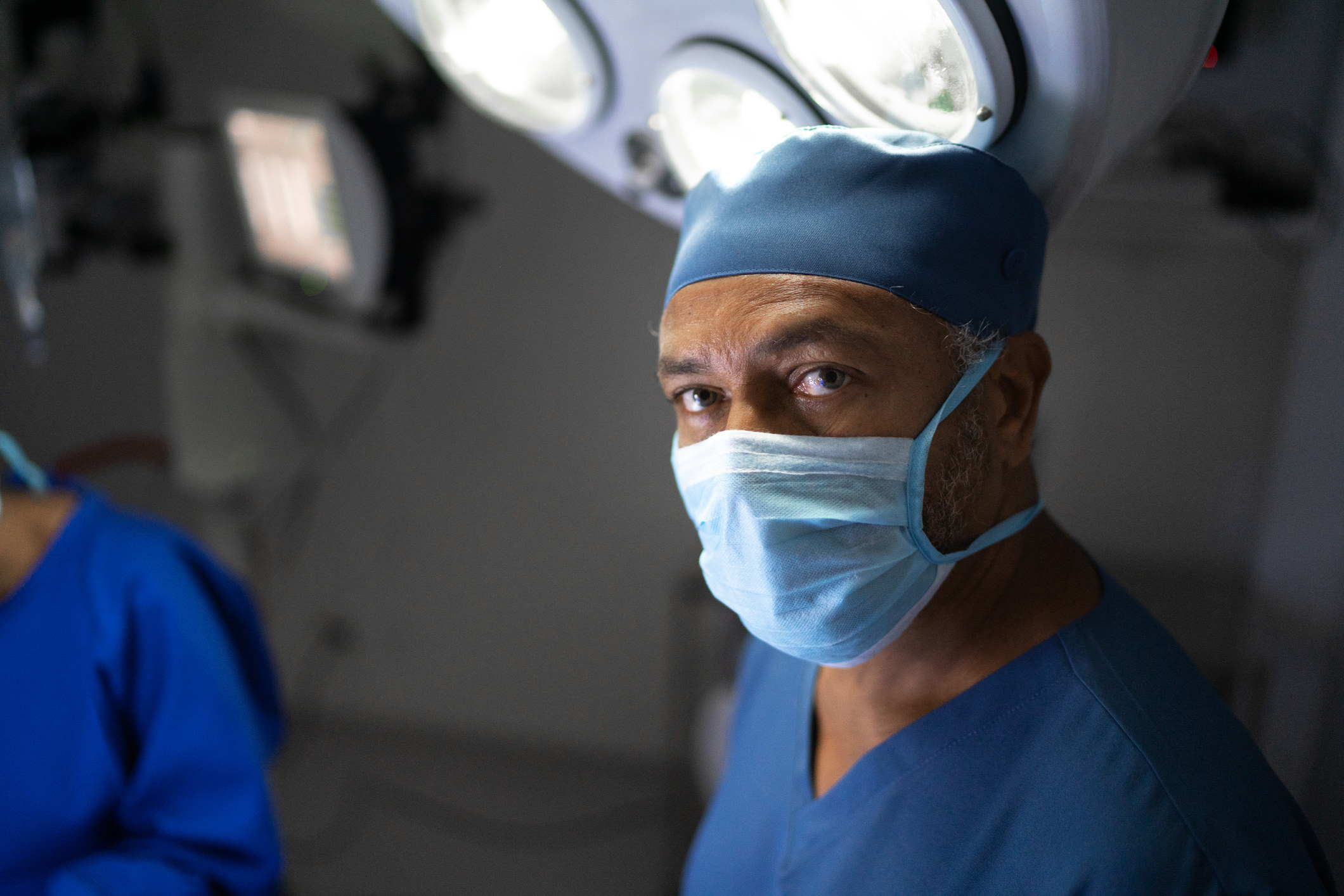 Portrait of a male healthcare worker in an operating room in a hospital.