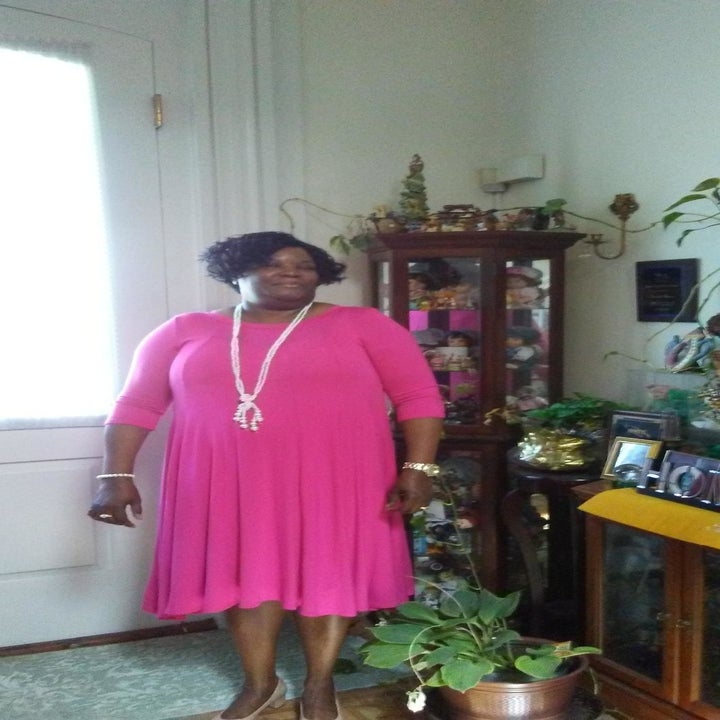 A different reviewer wearing the dress in pink