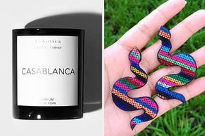 A Casablanca candle and colorful serpent earrings