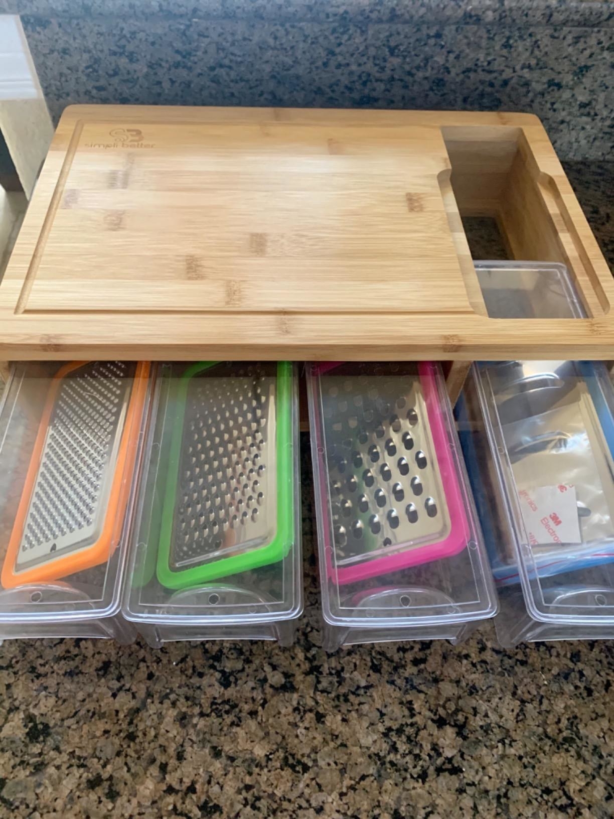 reviewer image of the bamboo cutting board with trays on a kitchen counter