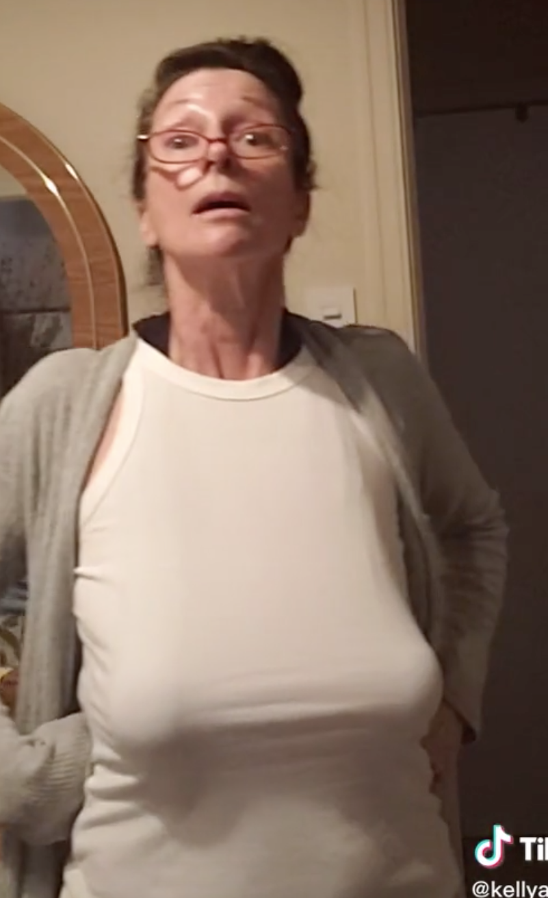 Photo of mom accentuating her boobs.