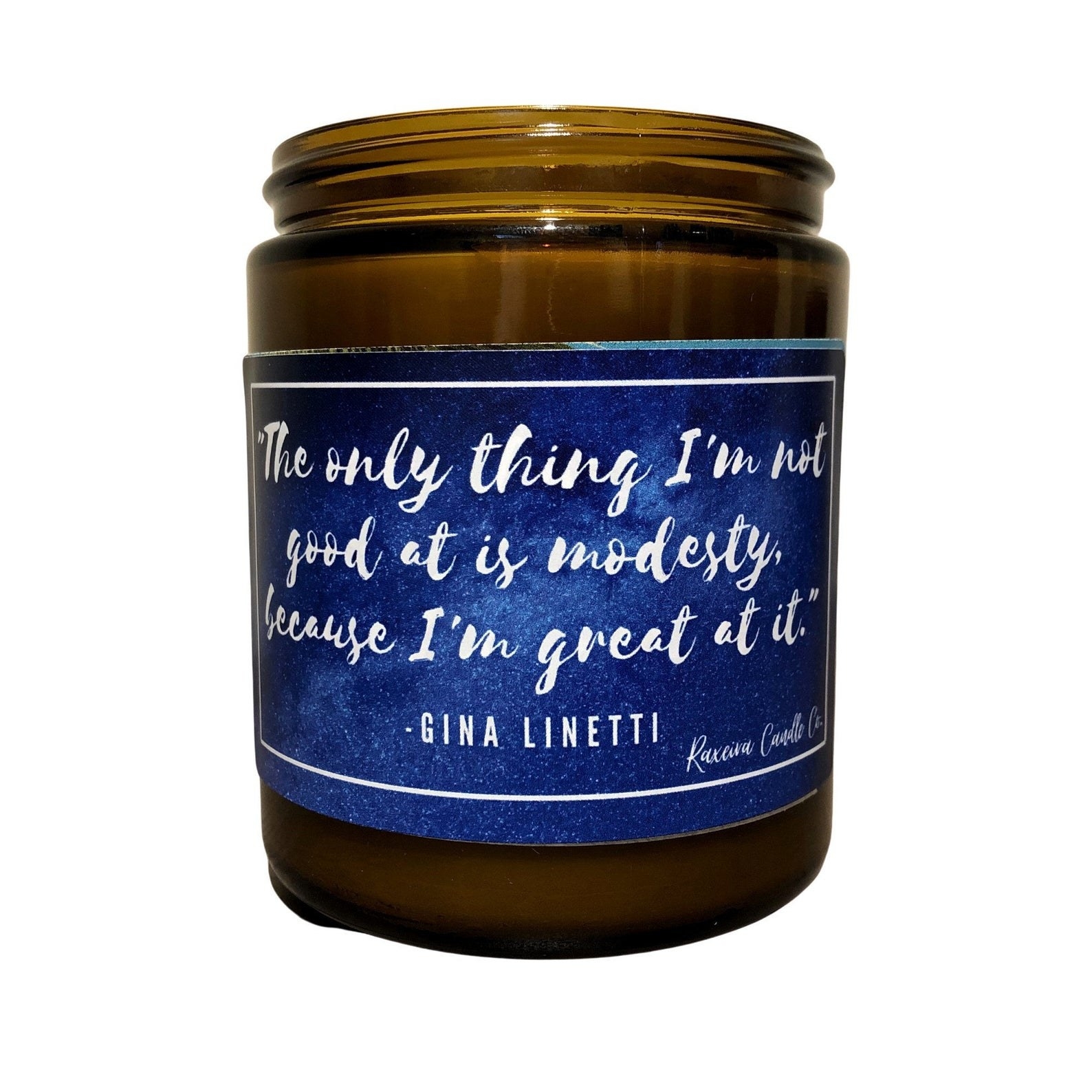 A candle that says the Gina quote &quot;The only thing I&#x27;m not good at is modesty, because I&#x27;m great at it.&quot;