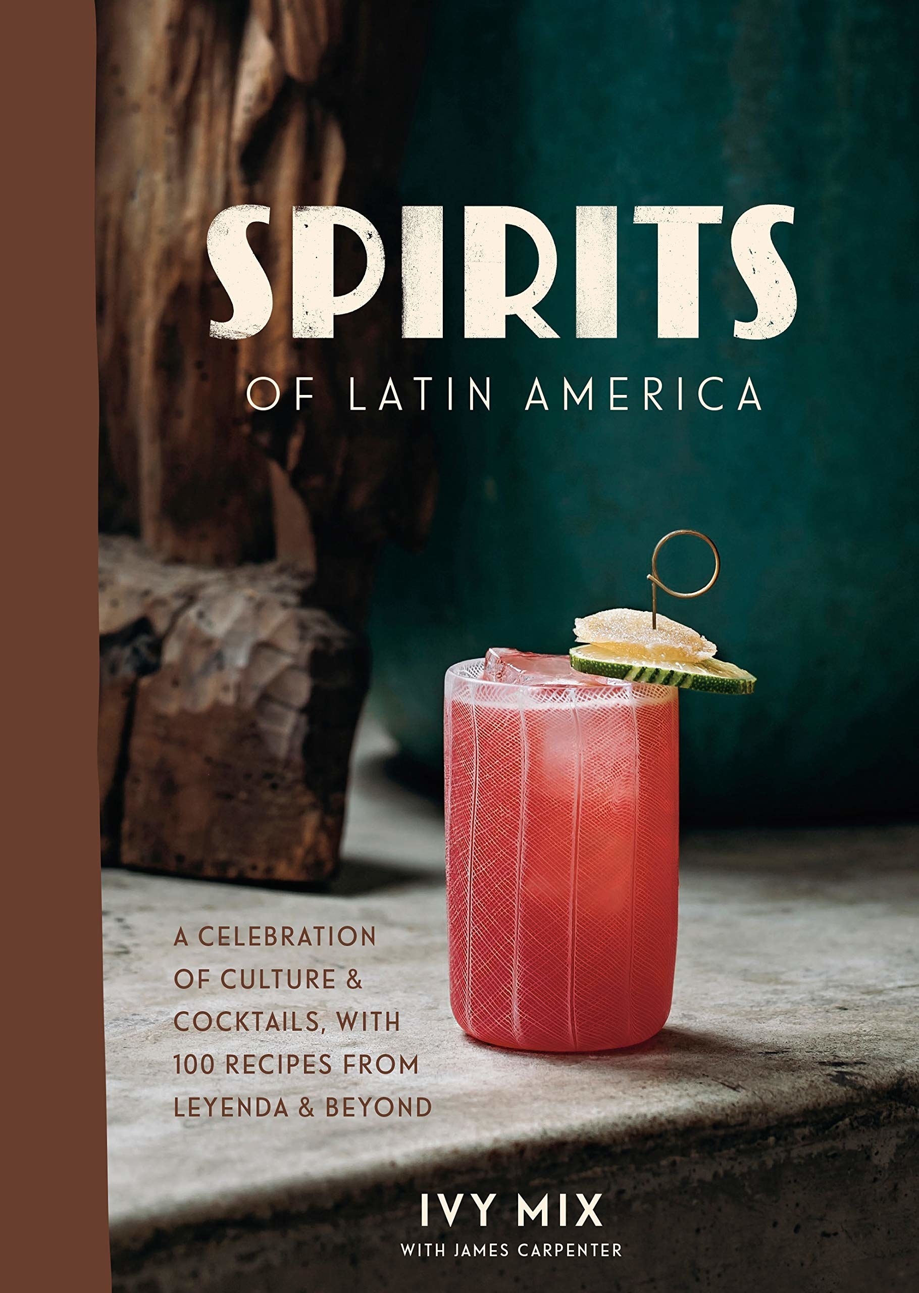 The book cover featuring a pink tropical drink on a wooden table