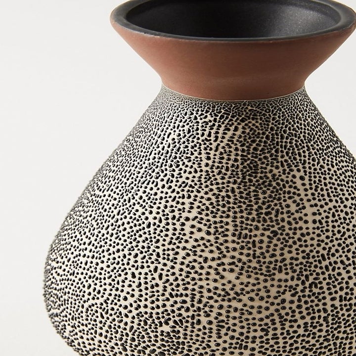 Closeup of medium spotted ceramic vase