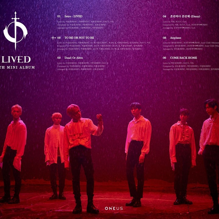 the six members standing in red rain with album track list above