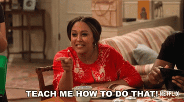 Tia Mowry pointing and saying, &quot;Teach me how to do that.&quot;