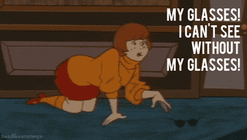 Velma looking for her glasses that are right in front of her