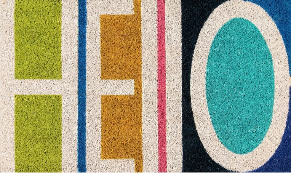 Multicolored doormat that says "hello"