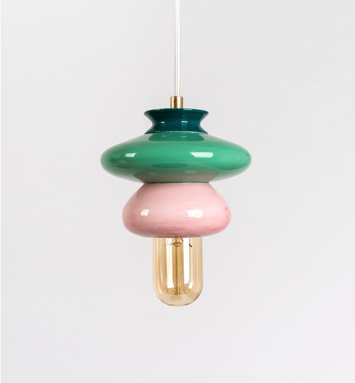 blobby like hanging lamp in green and pink with oblong lightbulb 