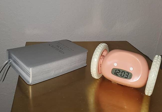 Reviewer alarm clock on table