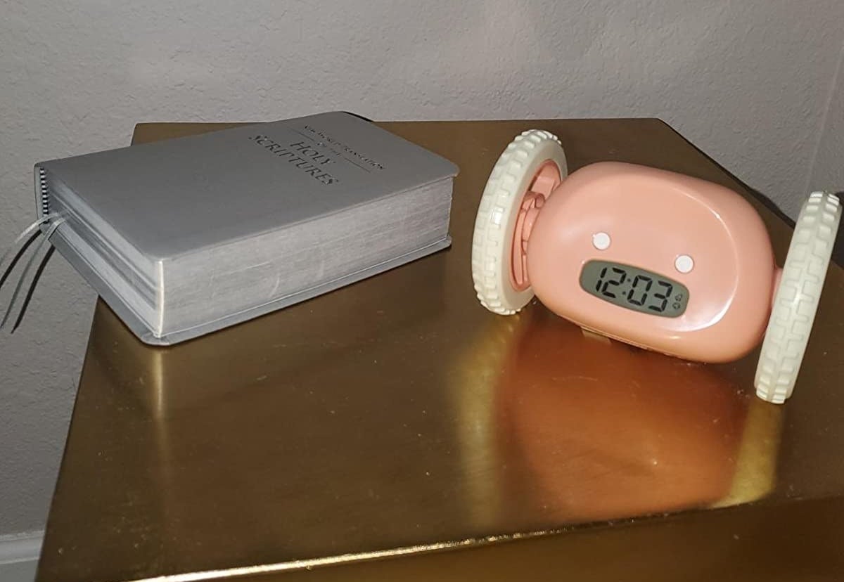Reviewer alarm clock on table