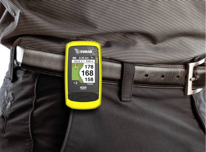 A model wearing the golf GPS on a belt loop