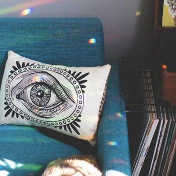 reviewer image of tiny rainbows reflected around a couch and room