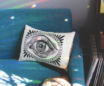 reviewer image of tiny rainbows reflected around a couch and room