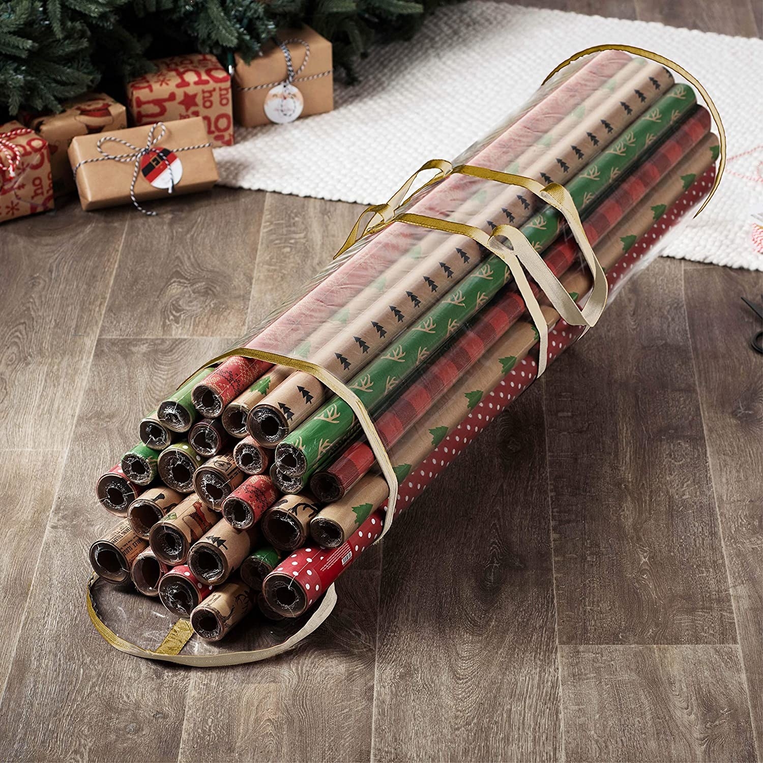 A large plastic bag on the floor with rolls of wrapping paper inside