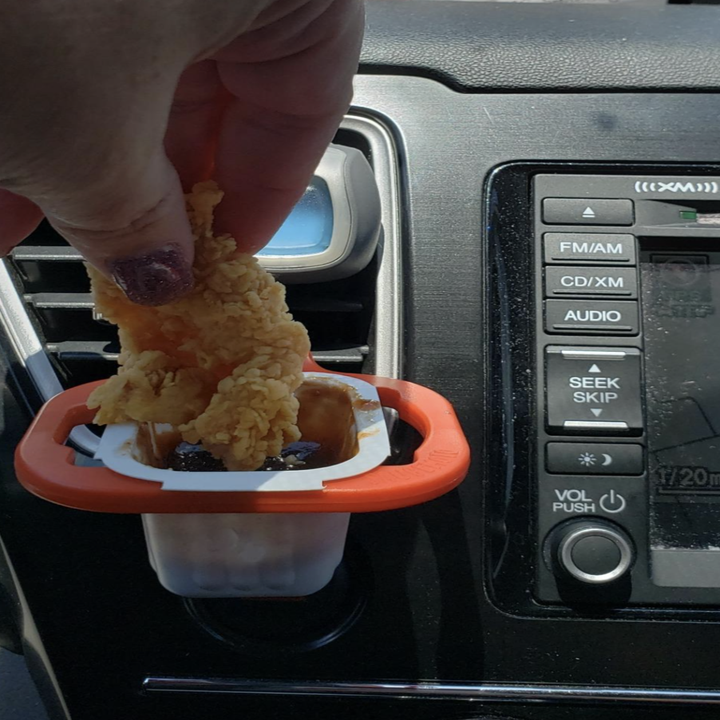 a reviewer dipping a chicken nugget