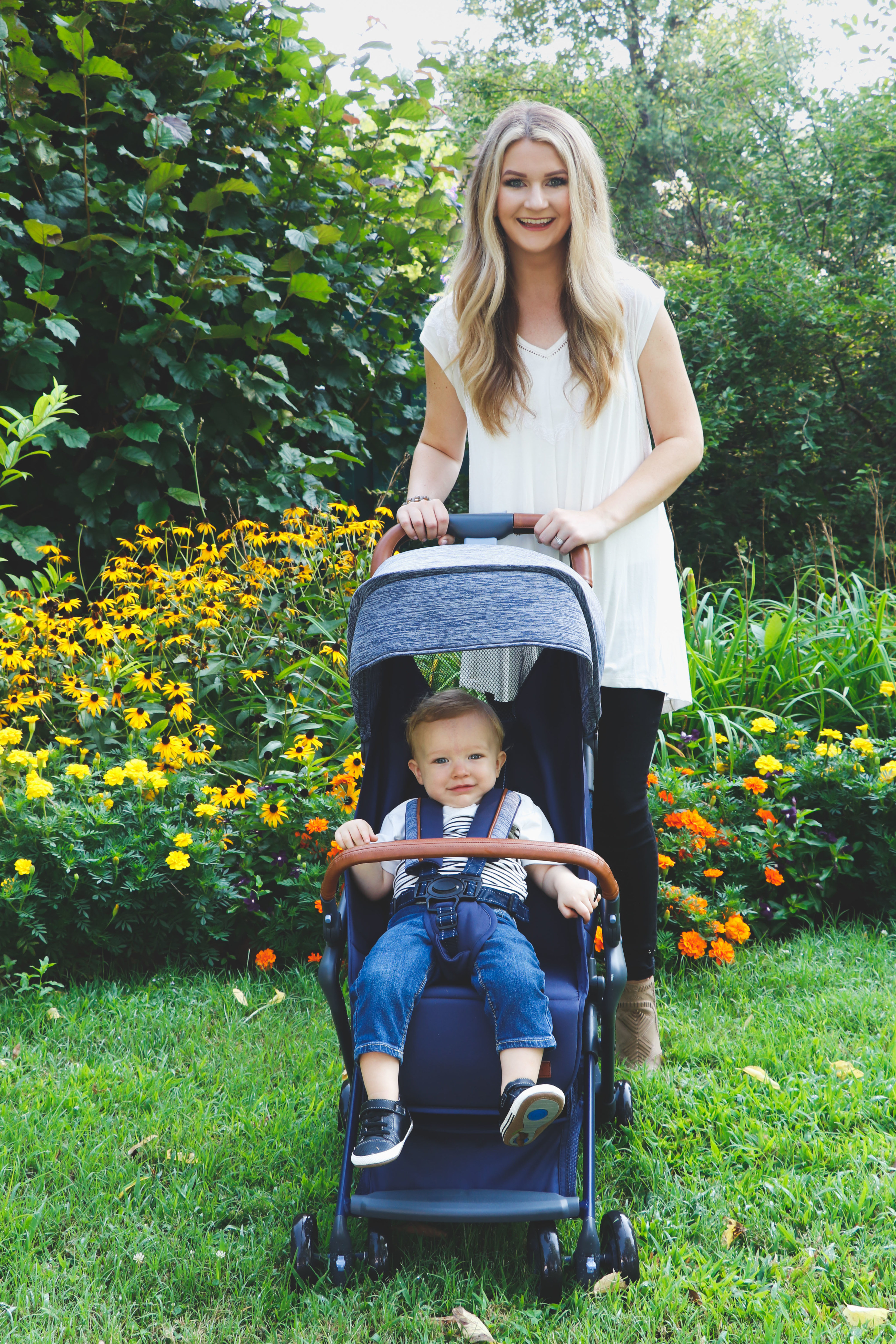 A model and baby using the stroller in a garden