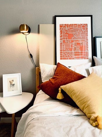 A different reviewer's photo of the gold sconce