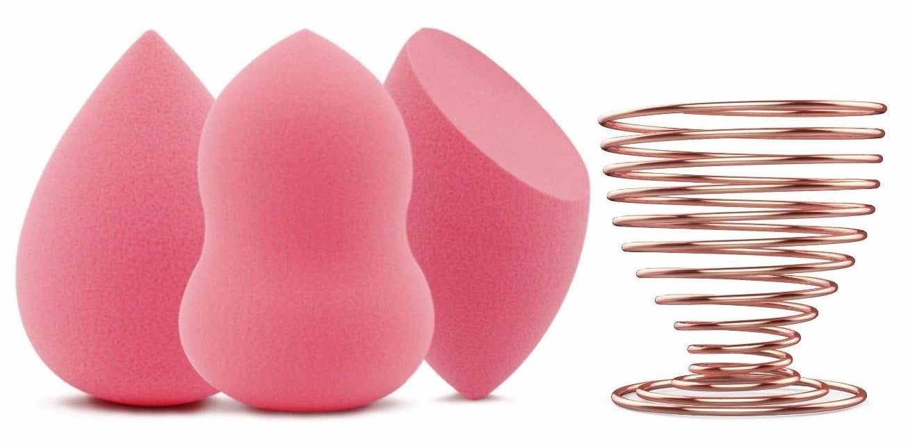 three various shaped makeup sponges with a metal holder for cleaning and drying the sponges