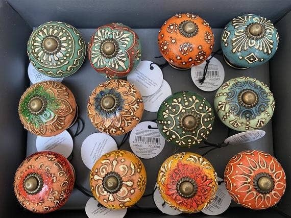 A variety of doorknobs in different colors