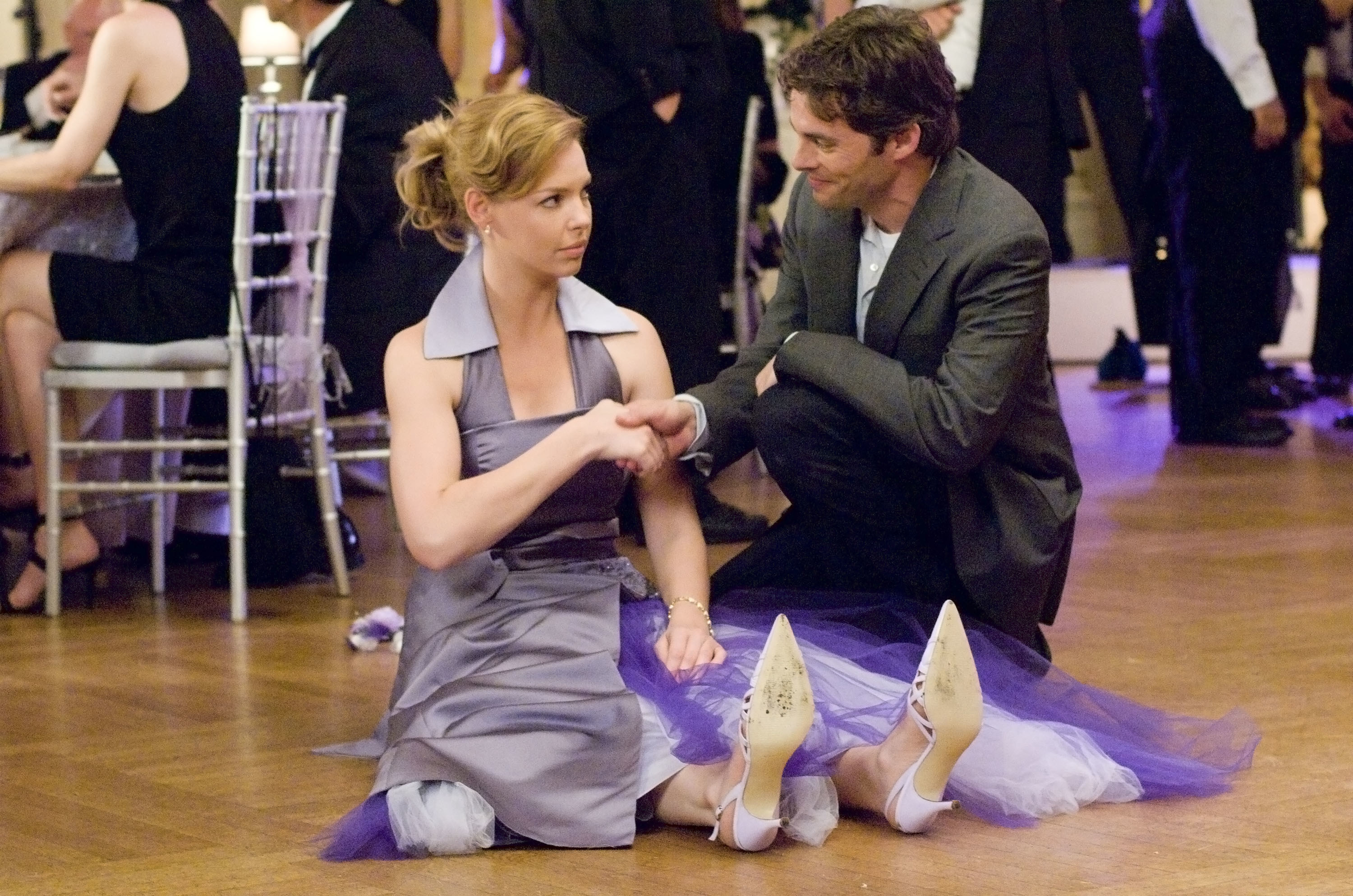 Kevin helping Jane up off of the floor 