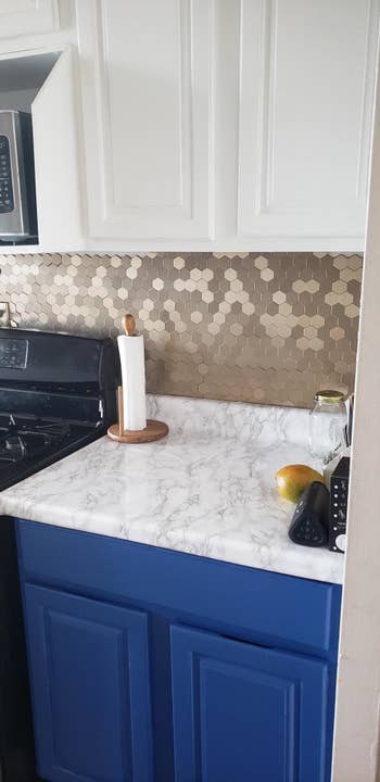 A reviewer's photo of their newly DIYed kitchen counter