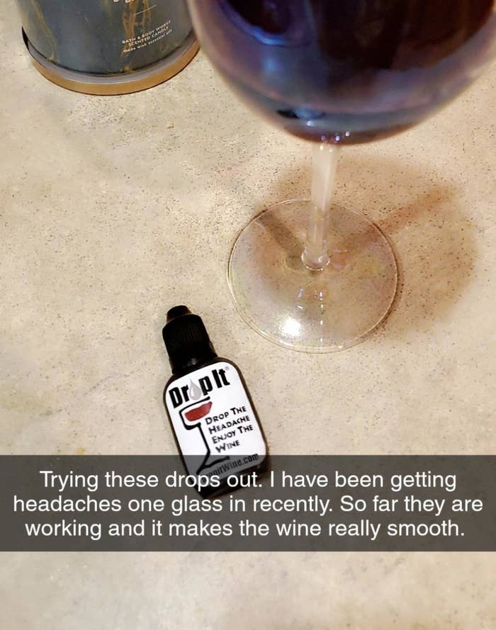 Reviewer photo of the drops next to a wineglass with the words &quot;trying these drops out. i have been getting headaches one glass in recently. so far they are working and it makes the wine really smooth&quot;