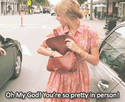 a gif of a fan telling taylor swift &quot;oh my god you&#x27;re so pretty in person!&quot;