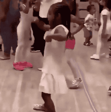 A gif of Blue Ivy dancing carefree during class