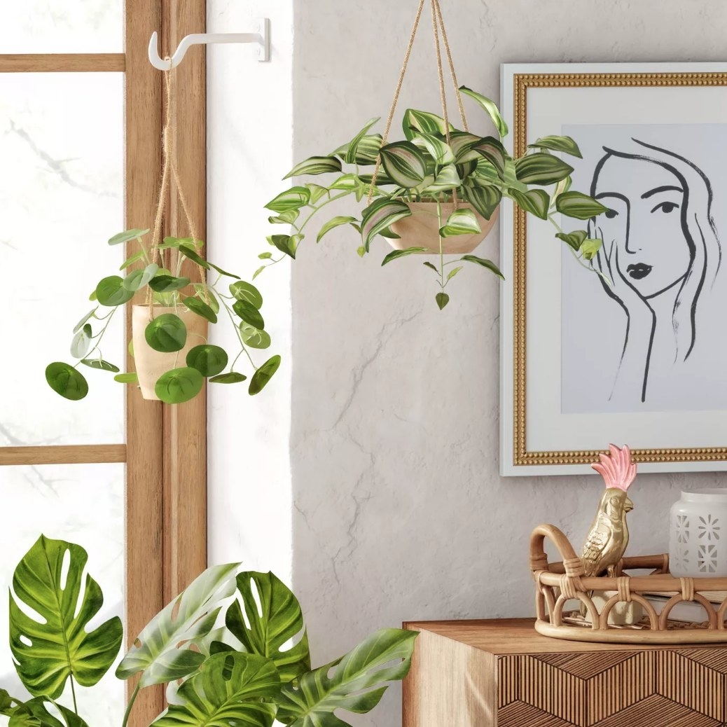 Faux plants in wooden hanging planter