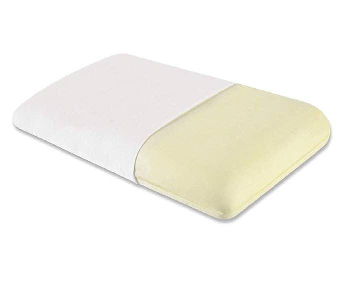 A cream and white memory foam pillow