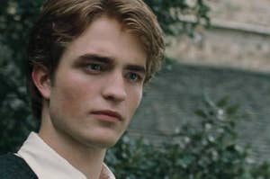 Cedric Diggory staring with a handsome yet slightly worried expression 