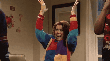 A gif of Kristen Wiig on SNL being comically excited