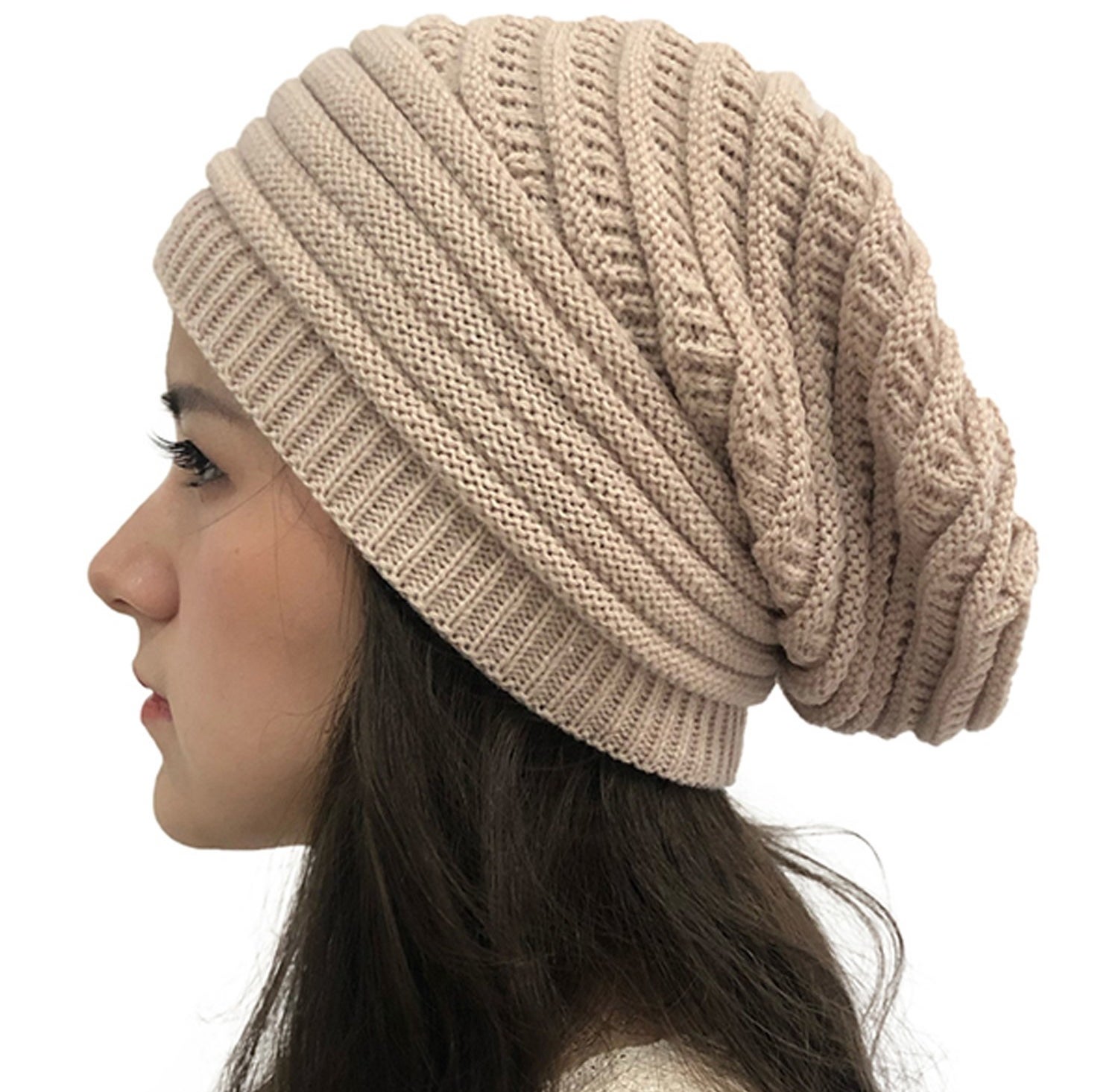 A close up of the beanie worn by a model