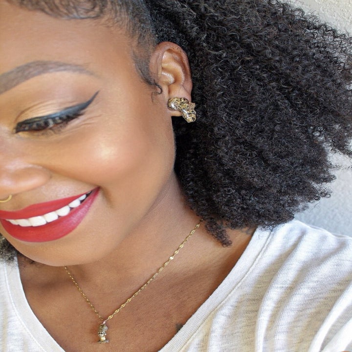 model wearing the Africa studs