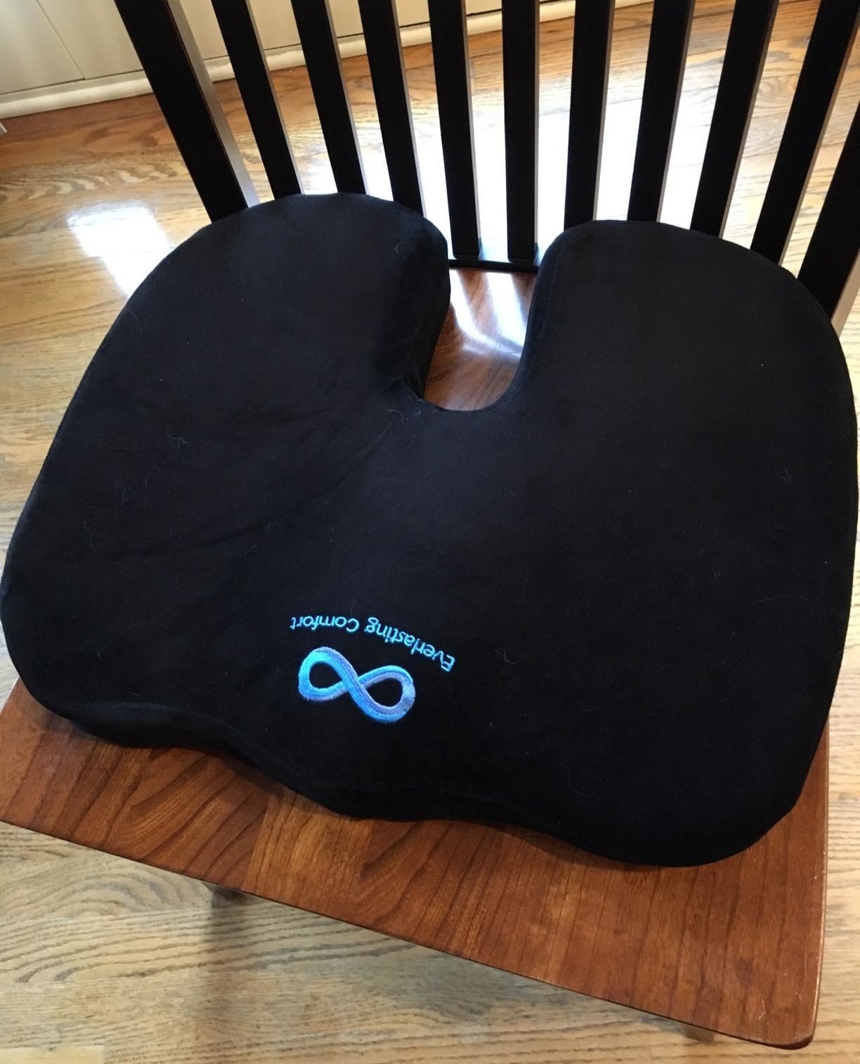 reviewer image of the everlasting comfort seat cushion on a wooden chair