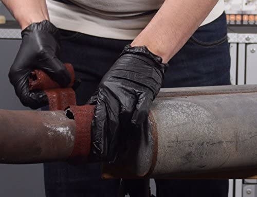 A person using FiberFix to repair an exhaust pipe
