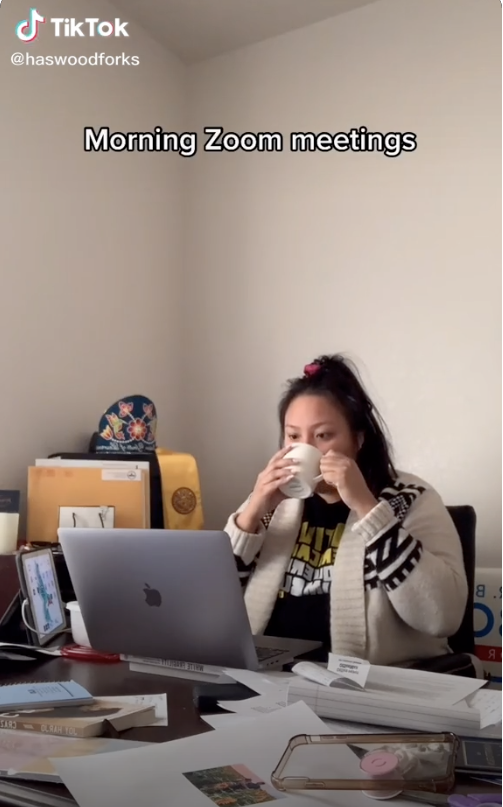 Representative Haswood sips from a coffee mug as she attends Zoom meetings