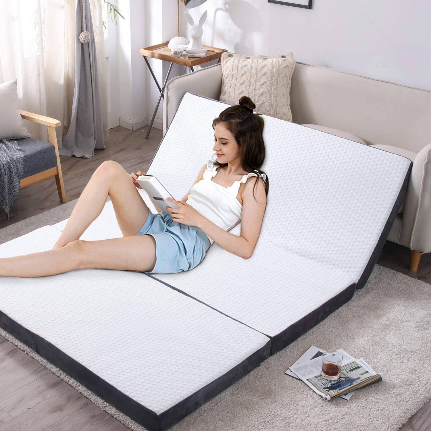 A person reading on the mattress