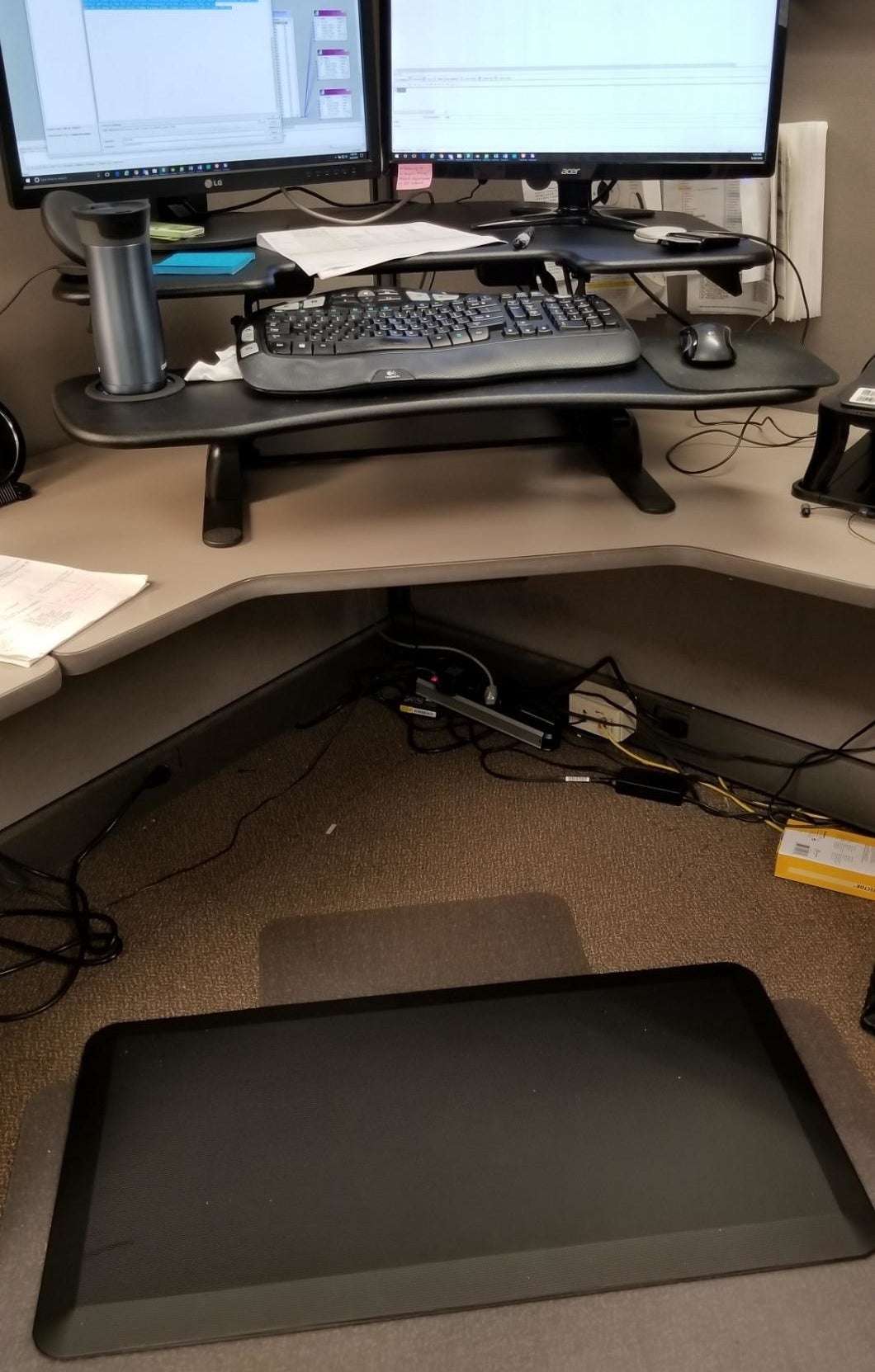 reviewer image of the sky solutions anti fatigue mat in front of their standing desk