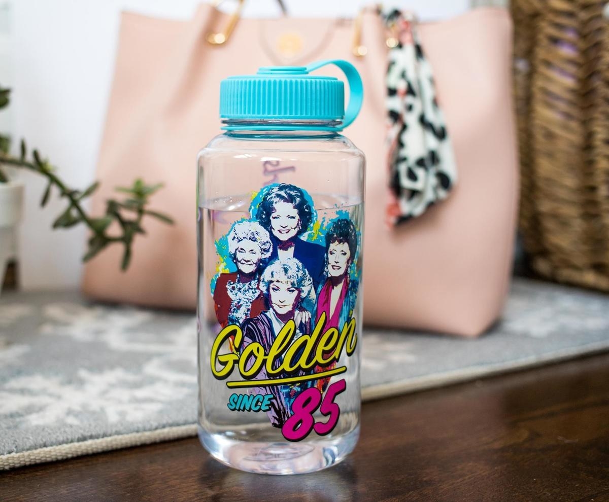 water bottle with &quot;The Golden Girls&#x27;&quot; face and text that says &quot;Golden since &#x27;85&quot;