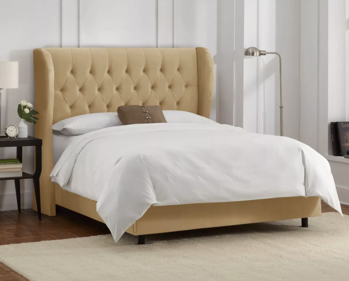 The yellow tufted bed frame