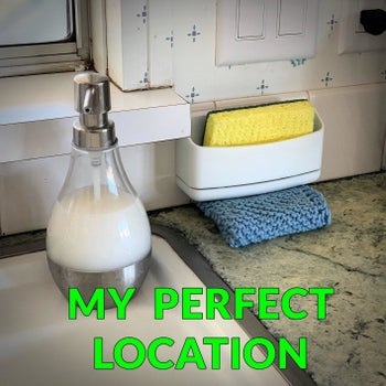 A reviewer's setup with the caddy attached to their backsplash, holding a sponge, with the text 