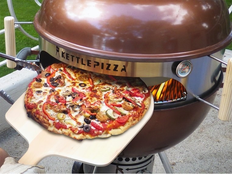 Kettle Pizza attachment attached to grill to make pizza oven